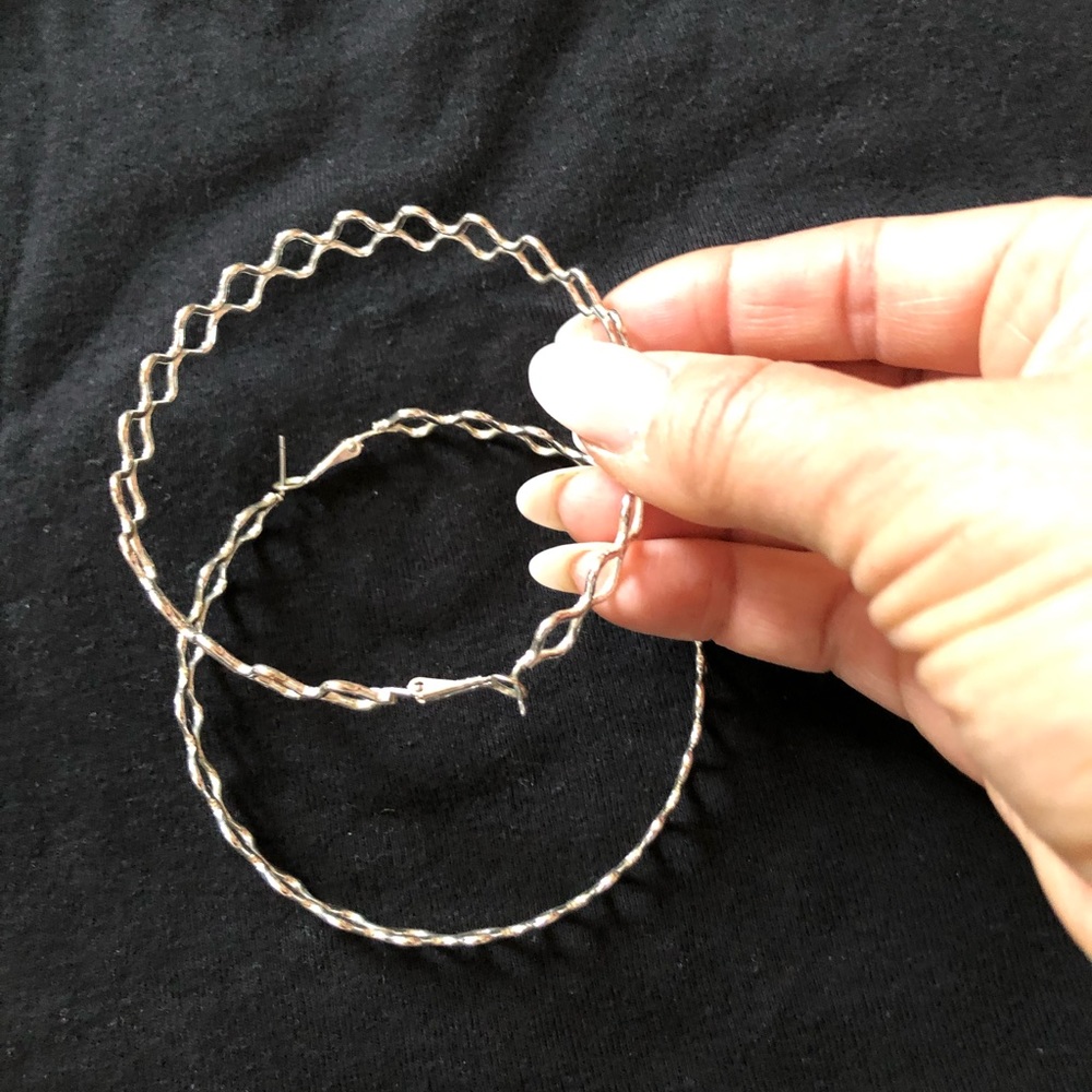 Large silver hoop earrings. Edgy and hip!